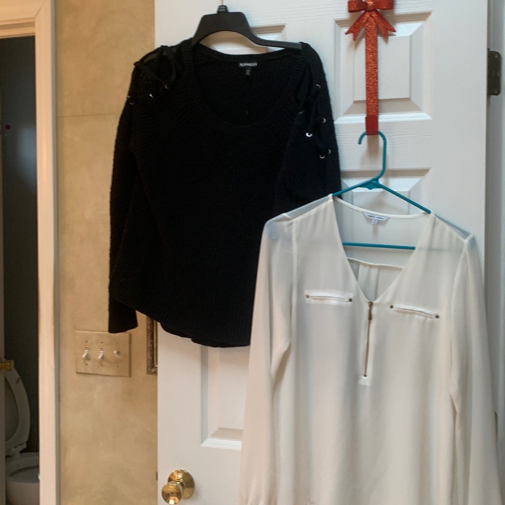 Black sweater with crisscross cross open shoulders & cream polyester blouse